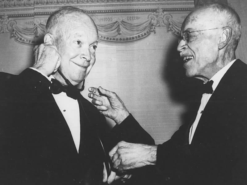 President Dwight D. Eisenhower uses a stethoscope to listen to the heart of Dr. Paul Dudley White, who had treated him for a heart attack. (American Heart Association)